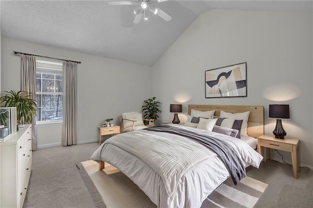 bedroom with light colored carpet, ceiling fan, and vaulted ceiling