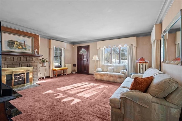 carpeted living room with a brick fireplace, radiator, and crown molding