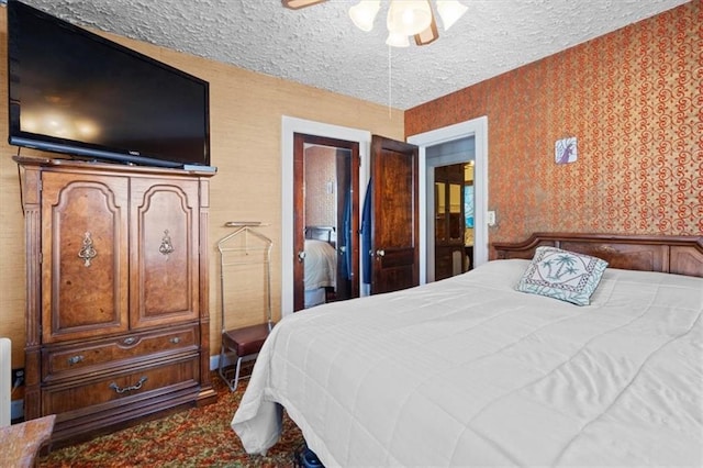 bedroom featuring a textured ceiling and ceiling fan