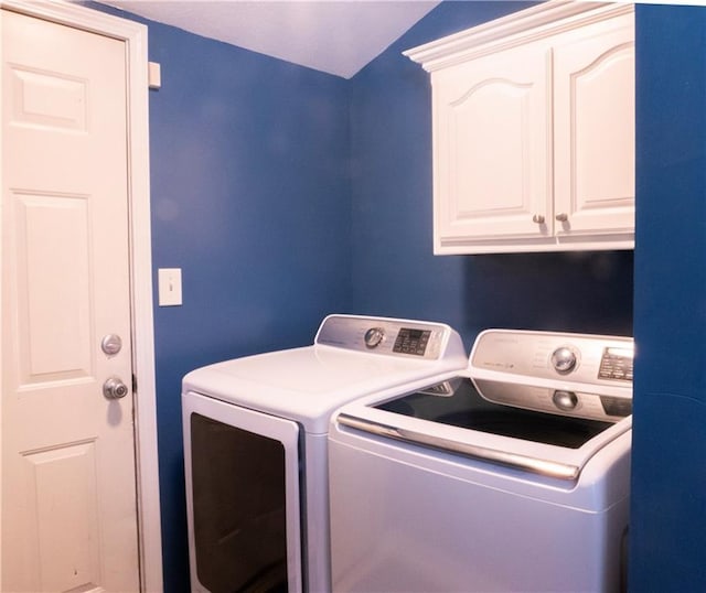 laundry area with cabinets and washer and dryer