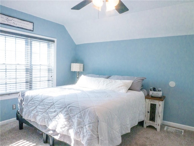 bedroom featuring lofted ceiling, carpet, and ceiling fan