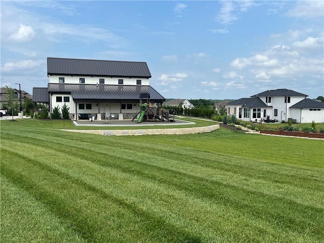 16920 Parkhill St, Overland Park, KS 66221 - rear view of property featuring a lawn and metal roof