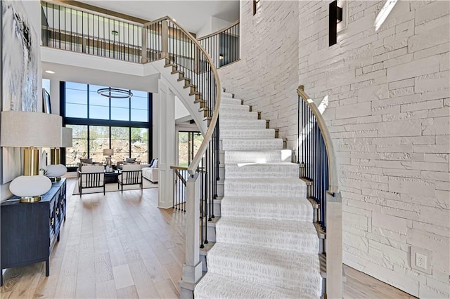 16920 Parkhill St, Overland Park, KS 66221 - stairway with a high ceiling and wood finished floors