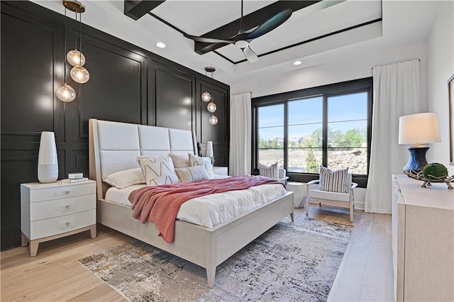 16920 Parkhill St, Overland Park, KS 66221 - bedroom featuring light wood-type flooring, recessed lighting, ceiling fan, and a raised ceiling