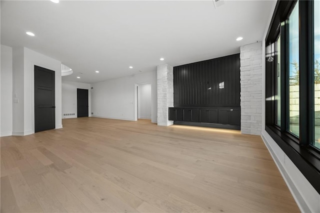 16920 Parkhill St, Overland Park, KS 66221 - unfurnished living room featuring light wood-style floors, baseboards, and recessed lighting