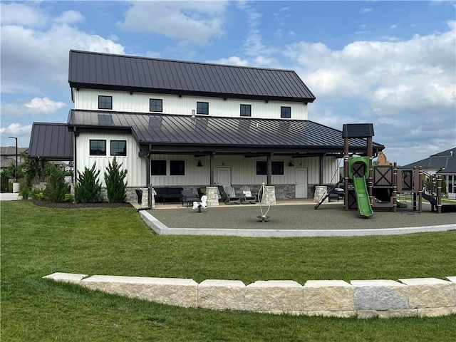 16920 Parkhill St, Overland Park, KS 66221 - rear view of house with board and batten siding, a lawn, a standing seam roof, and metal roof