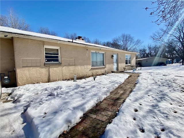 view of snow covered house