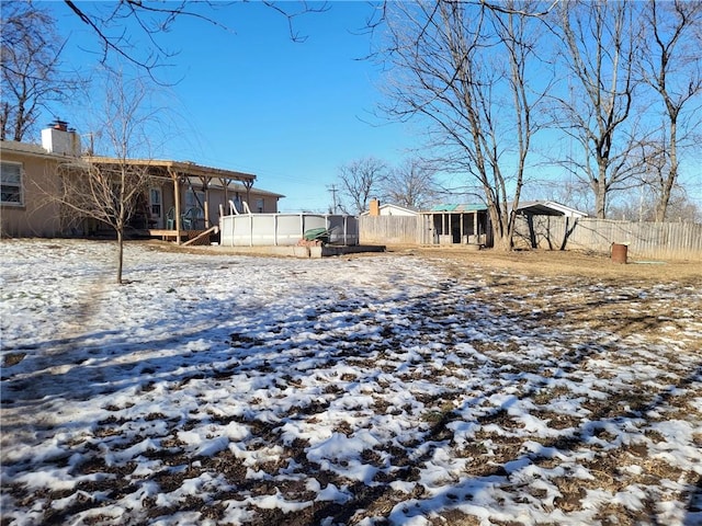 view of yard layered in snow