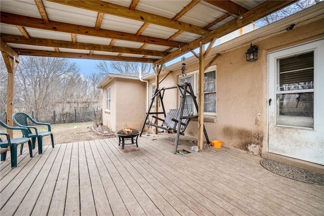 deck with an outdoor fire pit