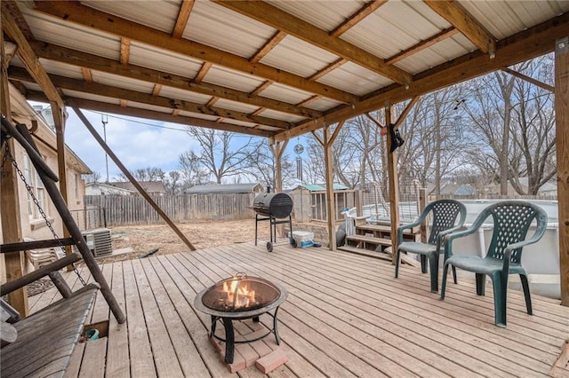 wooden deck featuring a fire pit