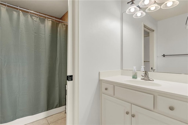 bathroom with tile patterned flooring and vanity