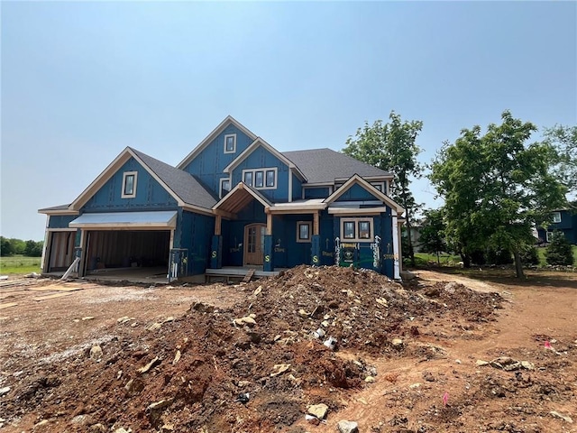 17028 Parkhill St, Overland Park, KS 66221 - view of front of property with a garage and board and batten siding