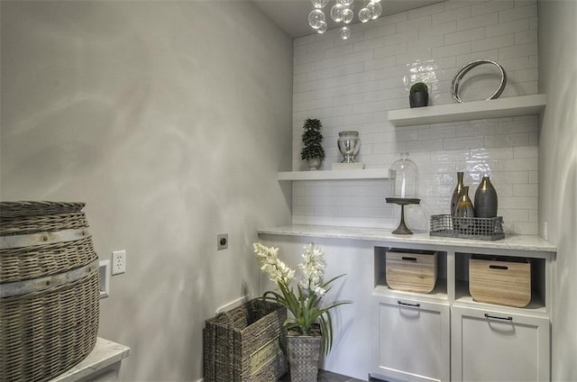 17028 Parkhill St, Overland Park, KS 66221 - bar area featuring tasteful backsplash and a chandelier