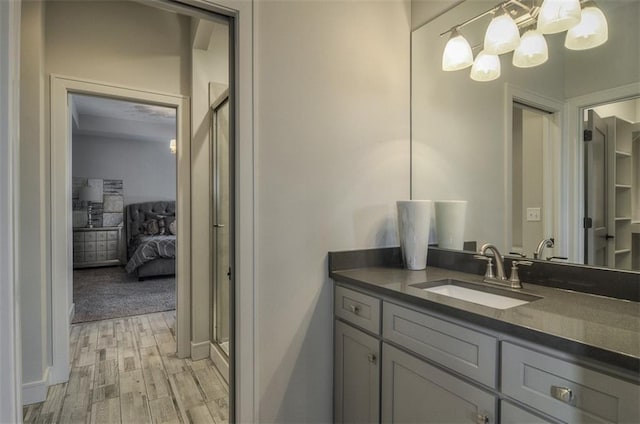 17028 Parkhill St, Overland Park, KS 66221 - full bath with vanity, wood finished floors, a stall shower, and connected bathroom