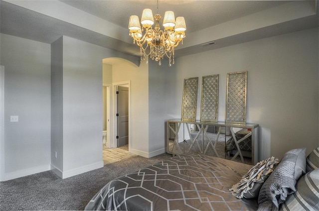 17028 Parkhill St, Overland Park, KS 66221 - carpeted bedroom with arched walkways, a chandelier, and baseboards