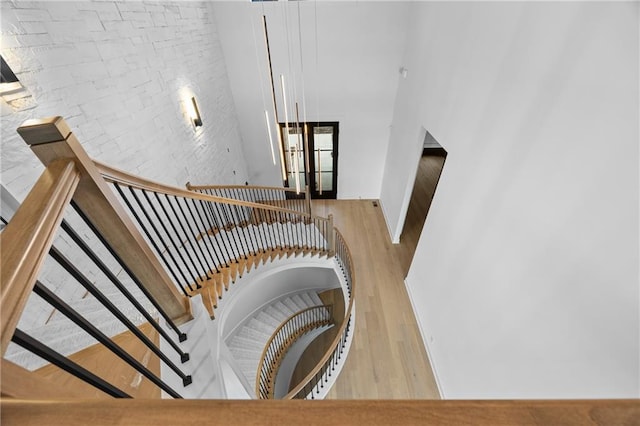 17028 Parkhill St, Overland Park, KS 66221 - stairway featuring wood finished floors and a high ceiling