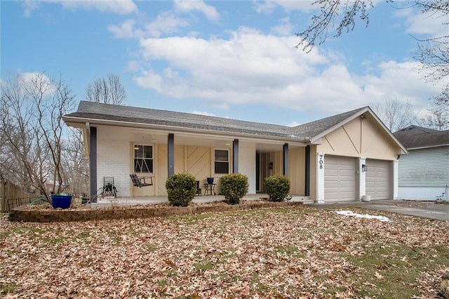 ranch-style home with a garage and a porch