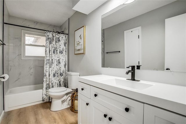 full bathroom with hardwood / wood-style flooring, vanity, shower / bathtub combination with curtain, and toilet