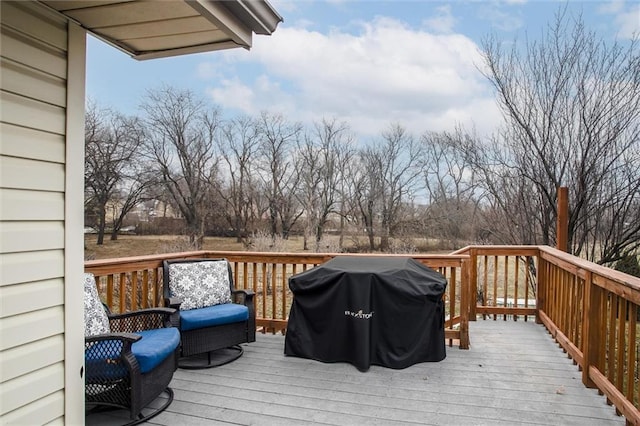 wooden terrace featuring area for grilling