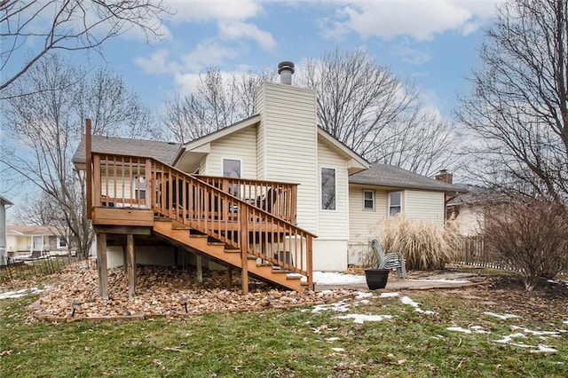 rear view of house with a wooden deck