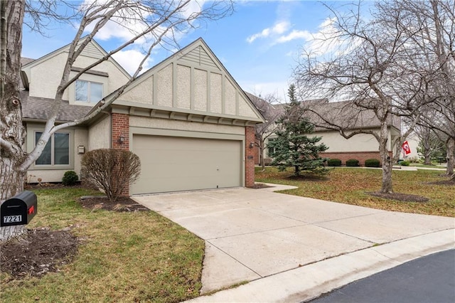 english style home with a garage and a front lawn