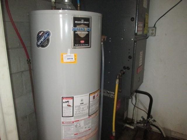 utility room featuring gas water heater