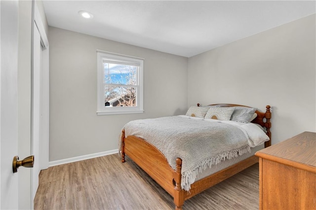 bedroom with light wood-type flooring