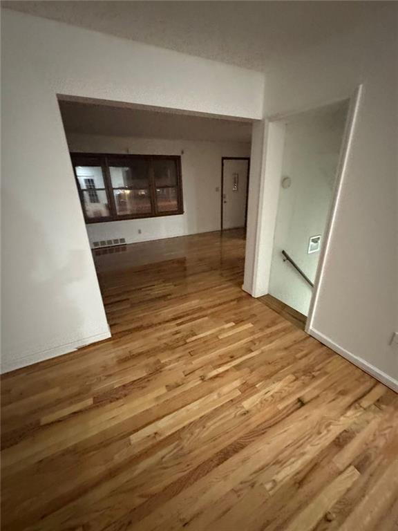 hallway featuring wood-type flooring