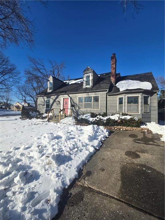 view of snow covered house