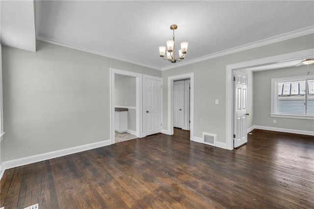 unfurnished room featuring ornamental molding, ceiling fan with notable chandelier, and dark hardwood / wood-style floors