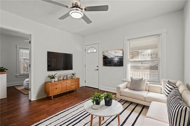 living room featuring dark hardwood / wood-style floors and ceiling fan