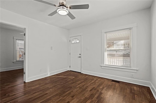 foyer entrance with ceiling fan and dark hardwood / wood-style flooring