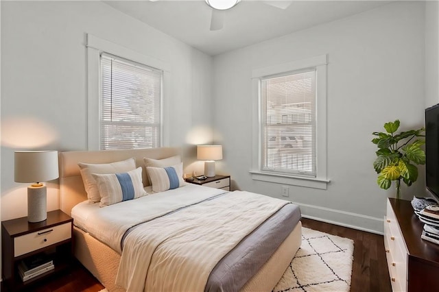 bedroom featuring ceiling fan and dark hardwood / wood-style flooring