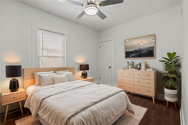 bedroom with dark wood-type flooring and ceiling fan