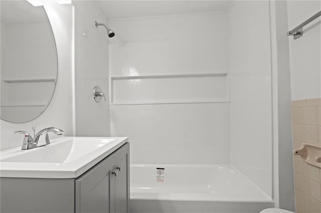 bathroom featuring vanity and tiled shower / bath combo