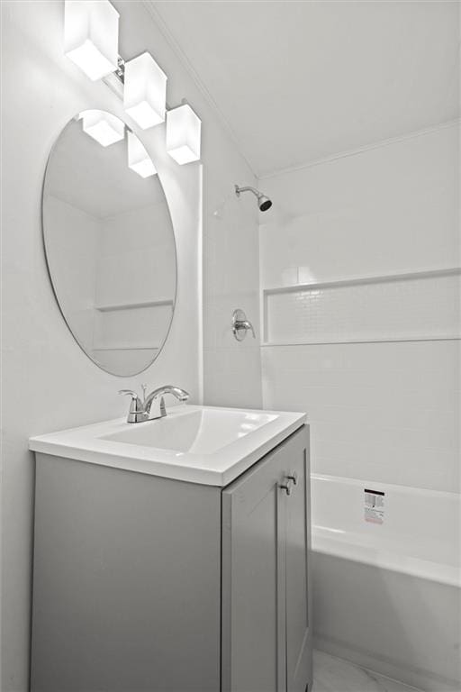 bathroom featuring vanity and tiled shower / bath combo