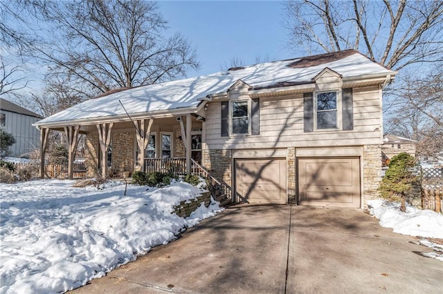 view of front of property with a porch and a garage