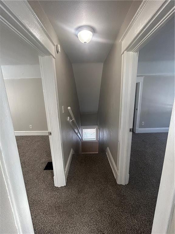 corridor with dark carpet