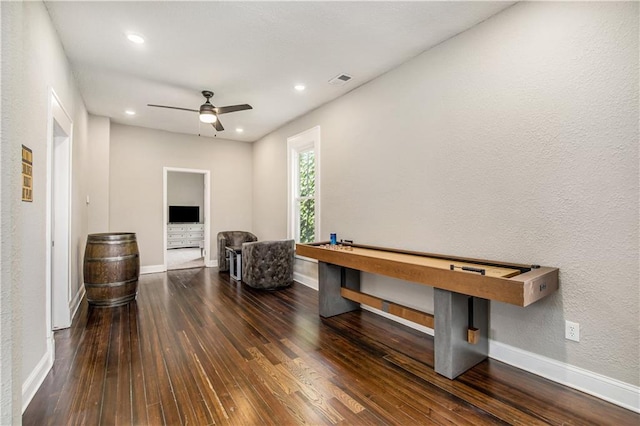 game room with ceiling fan and dark hardwood / wood-style floors