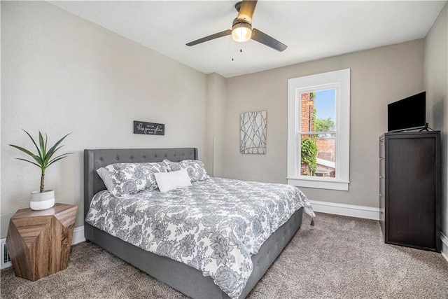 bedroom featuring light carpet and ceiling fan