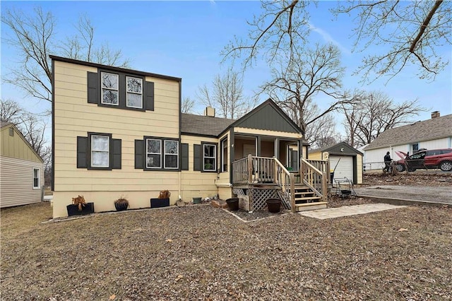 view of front facade featuring an outbuilding and a garage