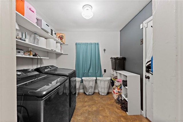 laundry area with washing machine and clothes dryer