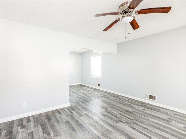 spare room featuring ceiling fan and light wood-type flooring