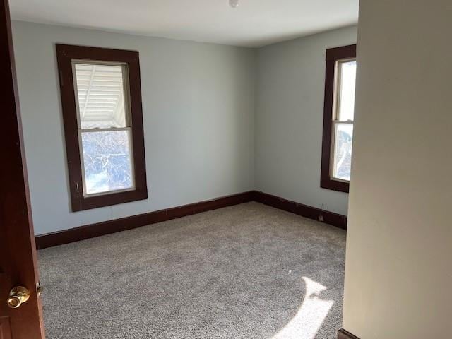 empty room with light colored carpet