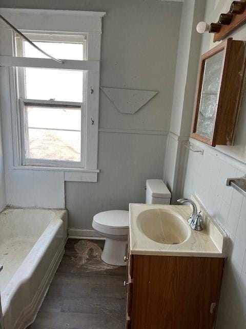 full bathroom with wood-type flooring, vanity, toilet, and separate shower and tub