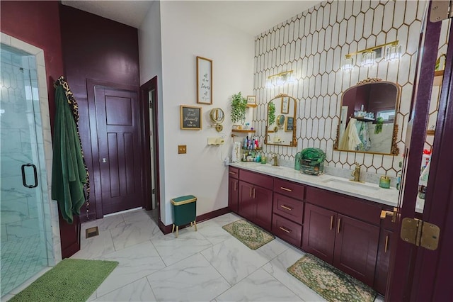 full bath with a sink, visible vents, marble finish floor, and a stall shower