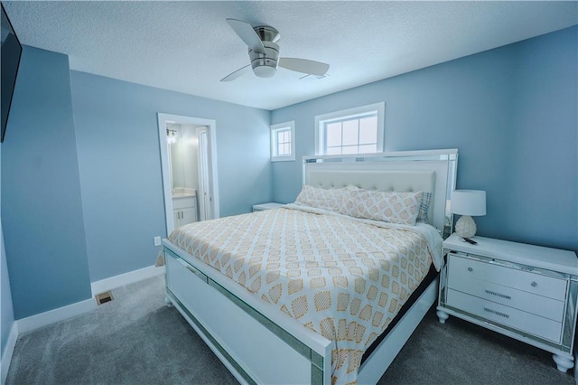 bedroom featuring connected bathroom, baseboards, carpet floors, a textured ceiling, and a ceiling fan