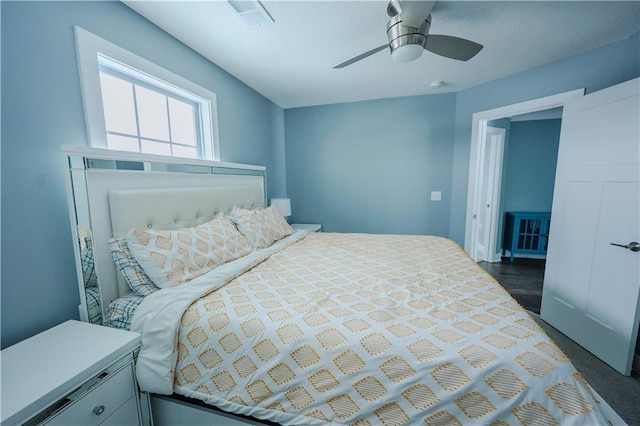 bedroom featuring visible vents and ceiling fan