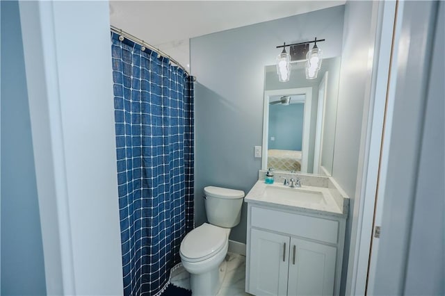 bathroom featuring toilet, curtained shower, vanity, and connected bathroom