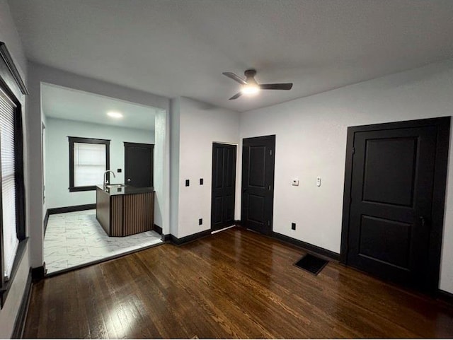 unfurnished bedroom featuring dark wood-type flooring